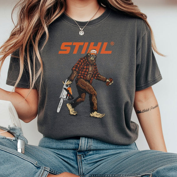 Bigfoot With Chainsaw T-Shirt | Funny Lumberjack Sasquatch Graphic | 100% Cotton Premium Tee | Unique Gift for Outdoorsmen an